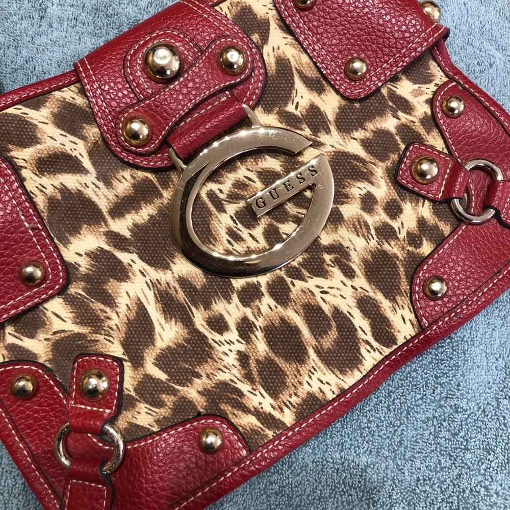 Guess purse Really Nice❤️ with gold hardware, red and animal cheetah design. HOT
